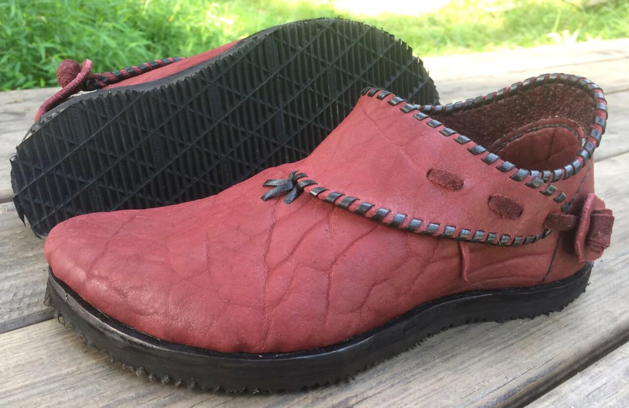Warm redwood leather complement black whip-stitching in these handmade walking shoes